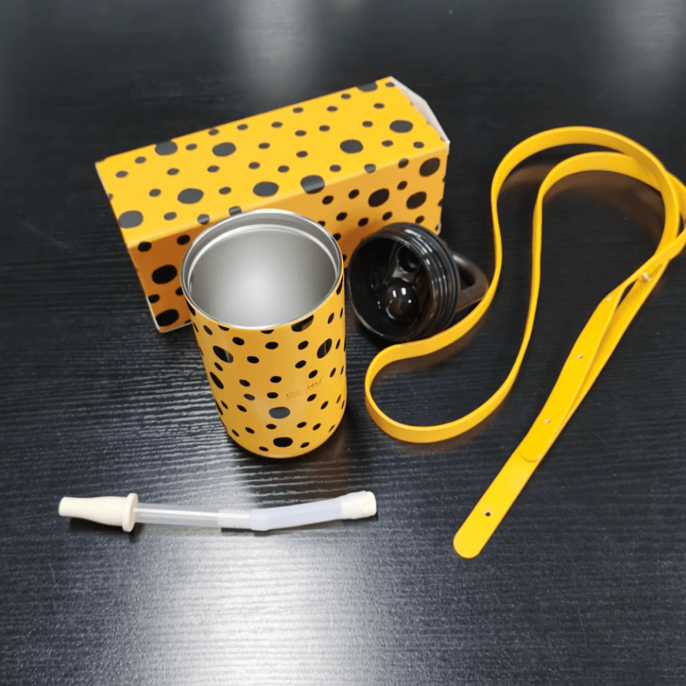Elegant Portable Coffee Cup with Black Polka Dots