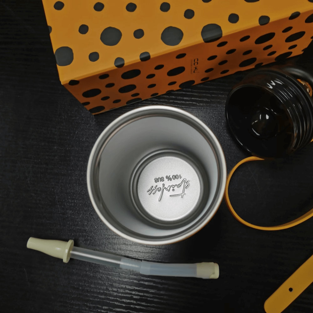 Elegant Portable Coffee Cup with Black Polka Dots