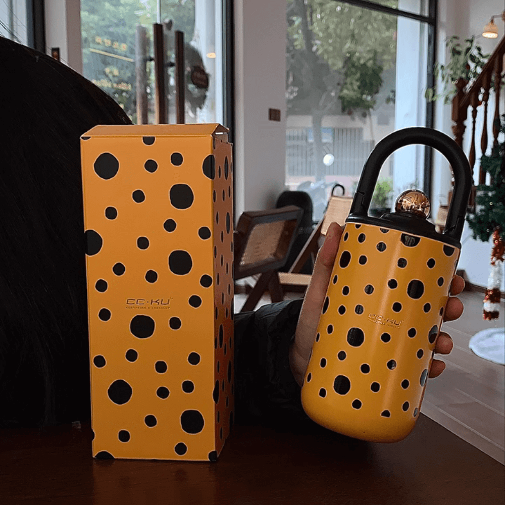 Elegant Portable Coffee Cup with Black Polka Dots
